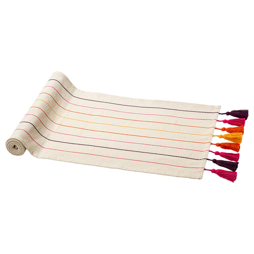 A beige AROMATISK rug with colourful stripes and tassels, made of 100% cotton.
