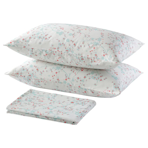This image shows a set of ASKLÖNN light blue cherry blossom-patterned bedding including a flat sheet and two pillowcases, all made of soft cotton.