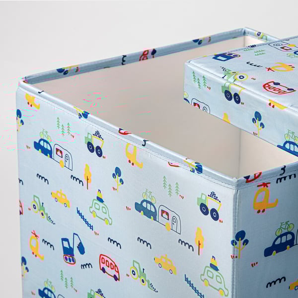 A soft, light-colored cubby with playful vehicle prints, likely for toys or storage, made from recycled materials and designed for kids.