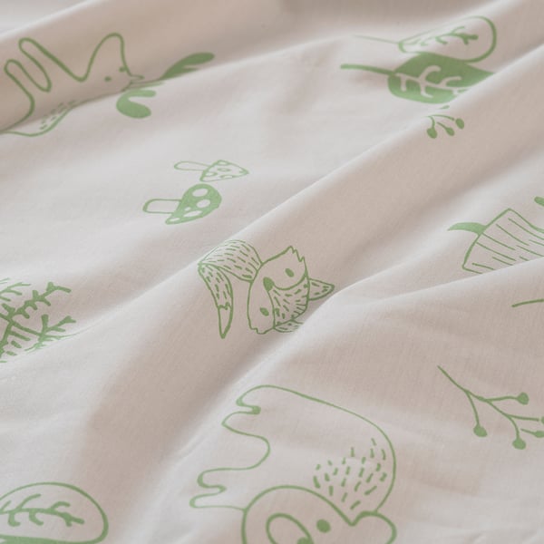 Light green forest animal prints on soft, creamy fabric.
