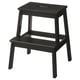 Black wooden step stool, simple design, two steps, handhole at top.