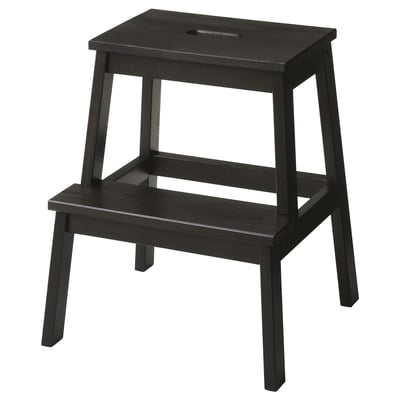 Black wooden step stool, simple design, two steps, handhole at top.