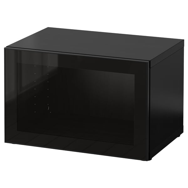 A black BESTÅ storage unit with a glass door and sleek design.