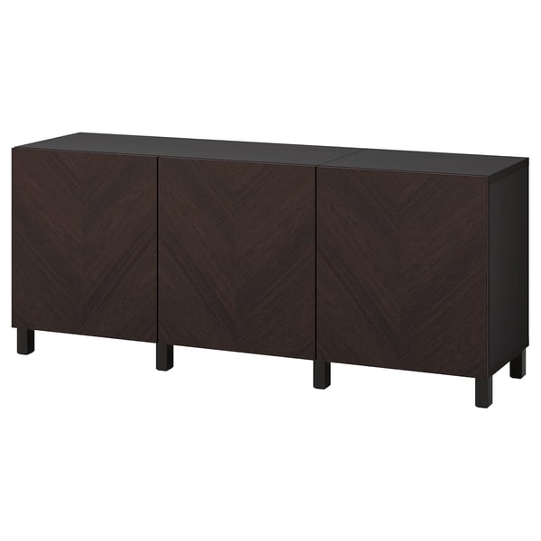 A dark brown wooden sideboard named BESTÅ. It three doors with a chevron design.