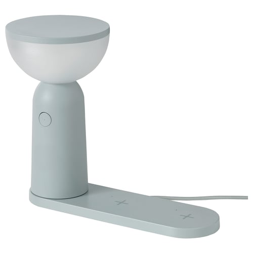BETTORP lamp, light blue, plastic, cylindrical base, bowl shape top, wireless charging pad.