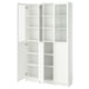 A white BILLY bookcase with glass doors, featuring multiple adjustable shelves for storage.