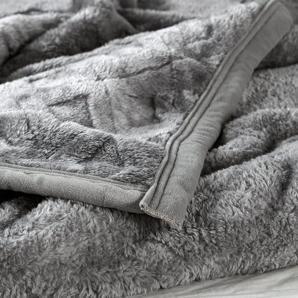 Thick, plush blanket with smooth, brushed surface; stitched seam detail for elegance.