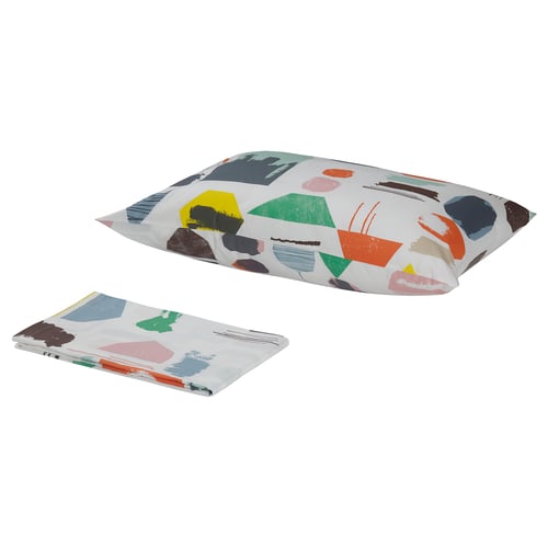 DOFTKLINT pillow & blanket set, colourful abstract shapes on white, cotton material, square pillow, folded blanket.