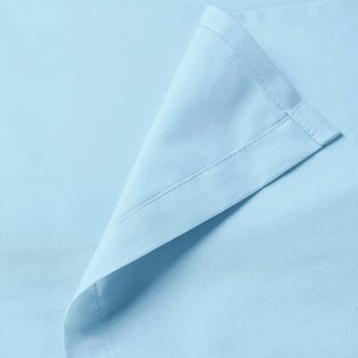 Folded light blue cloth napkin, neatly hemmed edges, displayed on a flat surface.