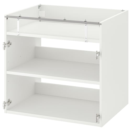 A white ENHET kitchen cabinet with three empty shelves and metal brackets, designed for a built-in hob.