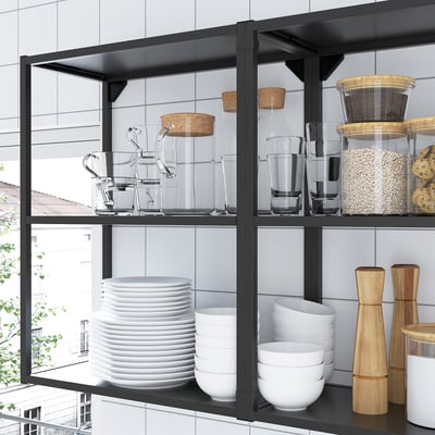 Open storage shelves holding glassware, dishes, and containers. Modern, sleek design with a 10-year guarantee.