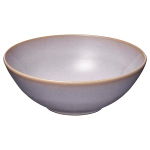 A lone lavender-hued stoneware bowl with a smooth, matt glazed finish and a rustic, handcrafted appearance.