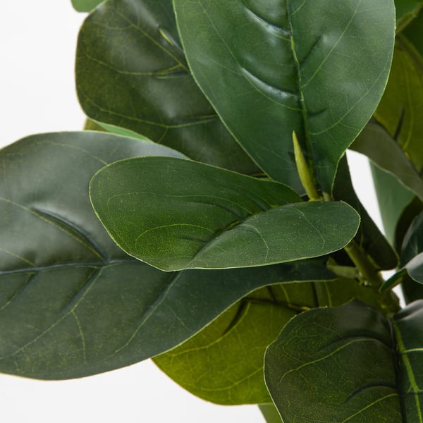 Large green artificial leaves, vibrant and lifelike, grouped together closely. Perfect for indoor or outdoor decor.