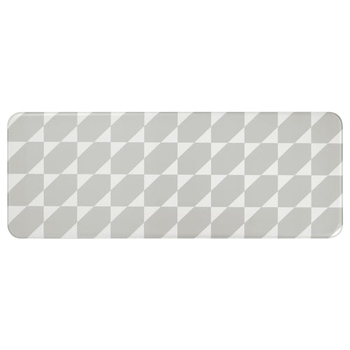 Grey and white chequered kitchen mat, rectangular with rounded corners, durable synthetic and foam material.