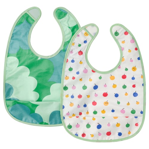 Colourful baby bibs: green with blue, white with fruit patterns.