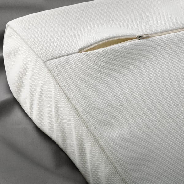 Zippered, light-colored cushion
