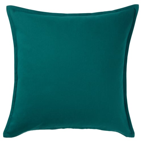 A GURLI cushion in teal colour. It is square-shaped with clean lines and made from 100% cotton.