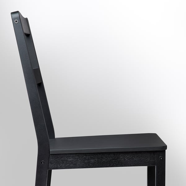 Black wooden chair with a simple, sturdy design and no cushion. Central leg supports the seat.