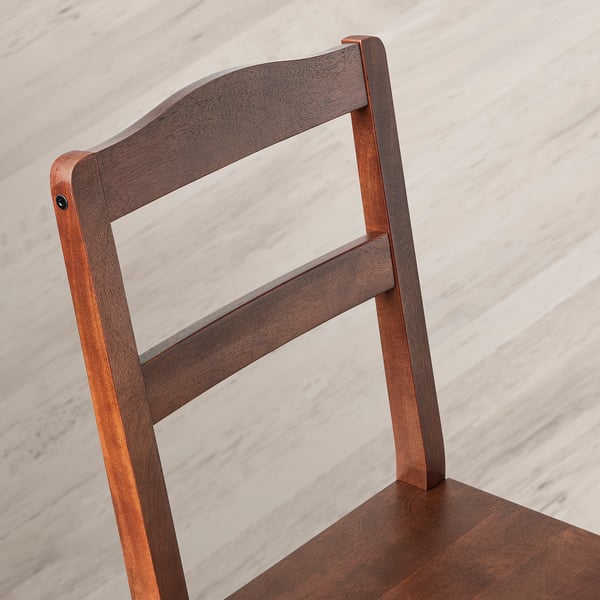 Dark wood chair backrest with sleek, sturdy design.
