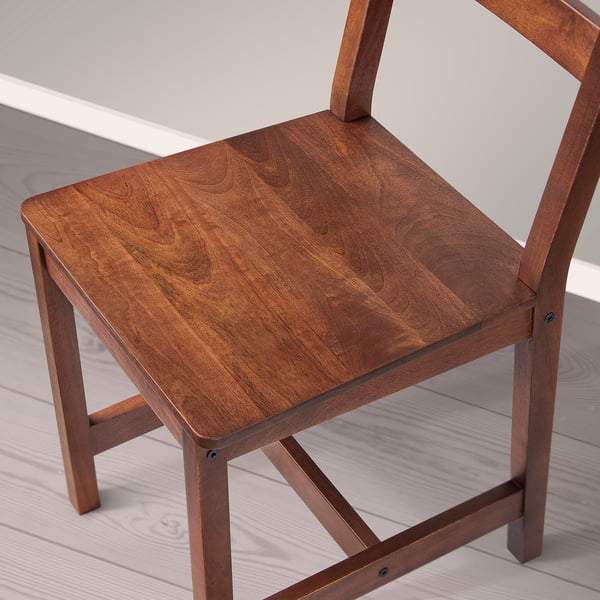 Wooden chair with smooth, dark finish. Square seat, sturdy legs with visible joints. Showing craftsmanship and quality.
