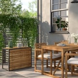 Small modern HÅKANSKÄR table, wood, and metal, used as a high table, near large window, signed by greenery.