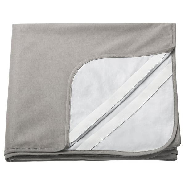 Grey waterproof mattress protector, folded, with white piping.