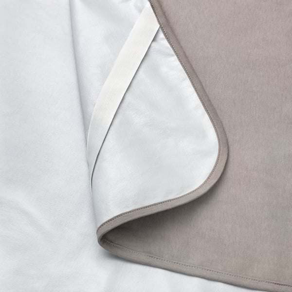 Folded waterproof mattress protector with visible stitching, showcasing quality craftsmanship and neat design. Cotton front, polyurethane back.