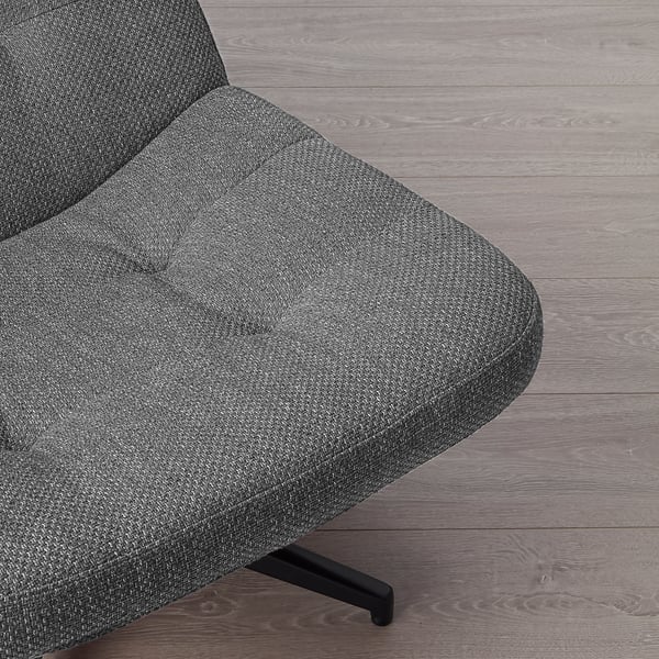 Close-up of modern, grey fabric swivel armchairs seat, showcasing textured, durable material and sleek black metal leg.