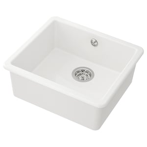 A white HAVSEN kitchen sink with a single bowl, round corners, and a strainer drain.