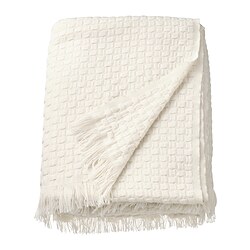 Off-white, recycled polyester throw with fringe, basket weave texture, folded neatly.