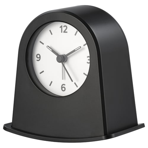 A black KÄRRSÅNGARE clock with a round face and minimalist design.