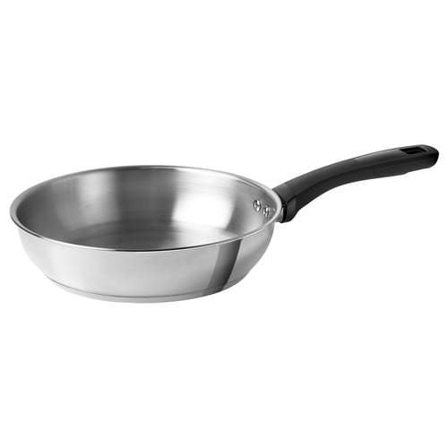 A KLIPPBROSME frying pan in silver with a black handle, made of stainless steel, designed for durability and versatile cooking.