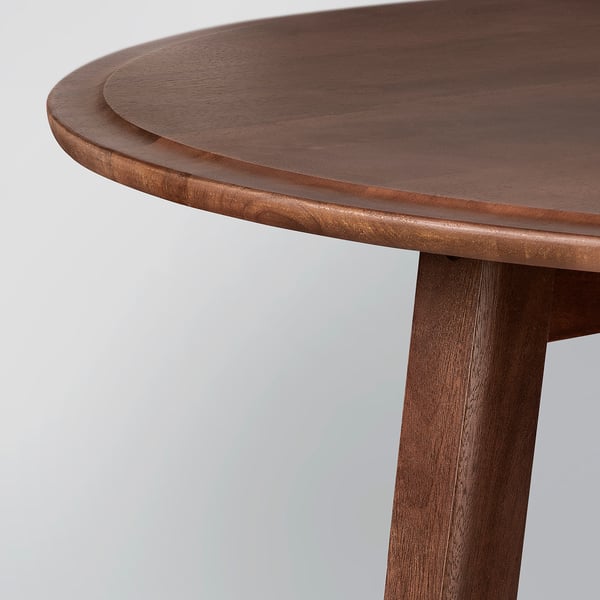 Round wooden coffee table with smooth, polished surface and sturdy, tapering legs. High-quality finish and elegant design.