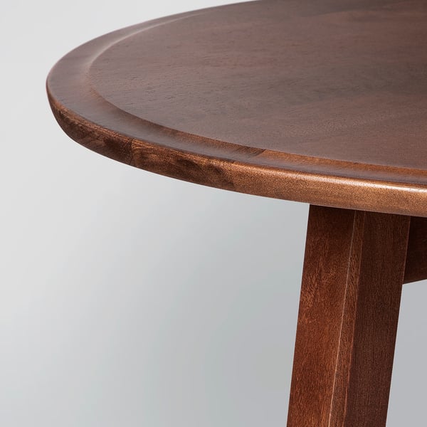 A polished, round wooden table with smooth edges, highlighting its high-quality craftsmanship.