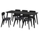 Black rectangular dining table with four matching chairs. Modern design with wood and fabric upholstery.