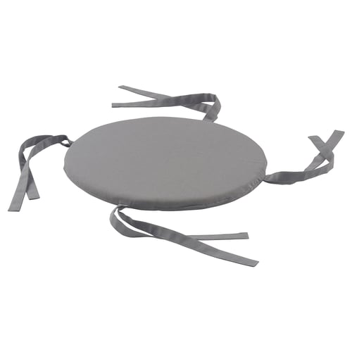 A round grey LYNNI chair cushion with ties for securing it, made of cotton and polyurethane foam.