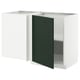 A white and dark green corner cabinet from the METOD kitchen system, featuring a modern design with a single door and an adjustable shelf.