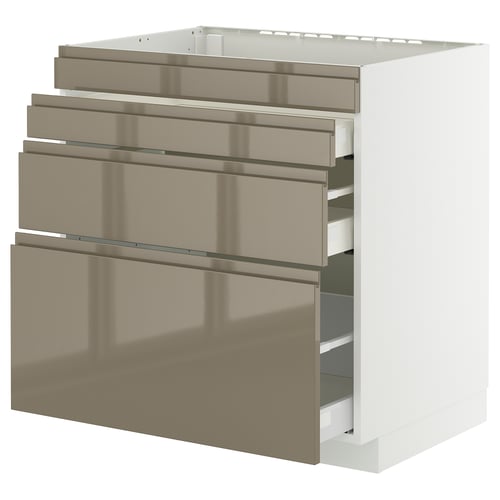 Depicts a METOD kitchen cabinet with four voxtorp high-gloss dark grey-brown drawers, each equipped with integrated handles, set against a white unit.