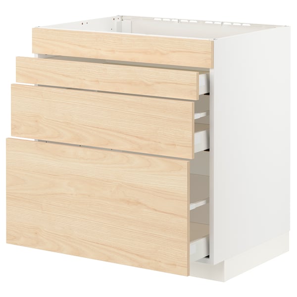 A white and light wood-colored kitchen cabinet with multiple drawers.