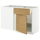 A white METOD kitchen unit with oak-colored drawers and a minimalist design.