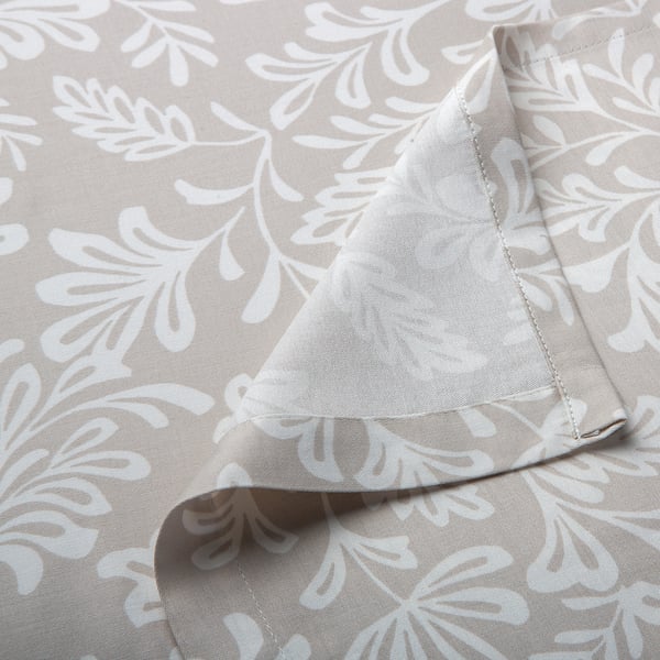 Soft, floral printed bed sheet in neutral tones, neatly folded, showcasing high-quality fabric and stitching.