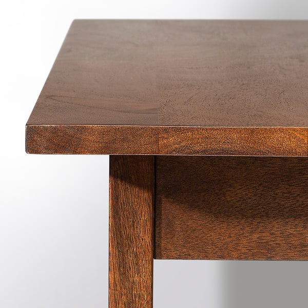 Solid wood table with dark, smooth finish. Visible grain and polished surface, supported by sturdy legs.