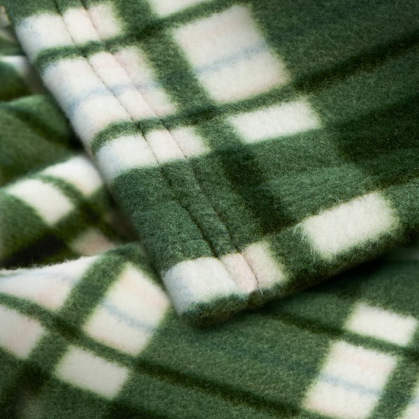 A plush, green and white chequered blanket; soft texture, folded neatly.