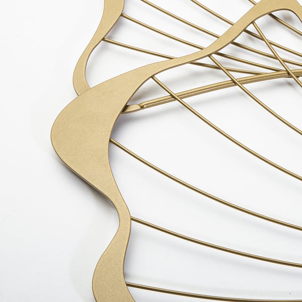 Gold metal wall decoration, intricate wavy patterns, high-quality finish.