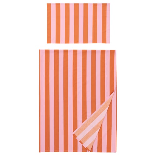 Two striped orange and pink bed linens, one folded, the other crumpled.