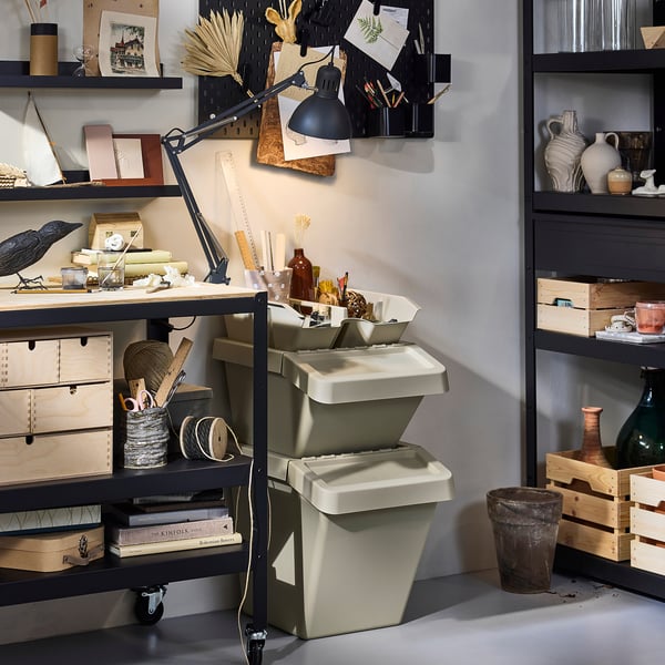 Office space with SORTERA beige storage bins, shelves, and decor.