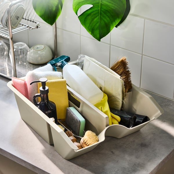 White SORTERA bin with cleaning supplies, multi-compartments.