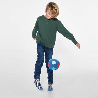 Child playing with SPARKA ball, a soft, indoor toy perfect for developing motor skills and fun play time.
