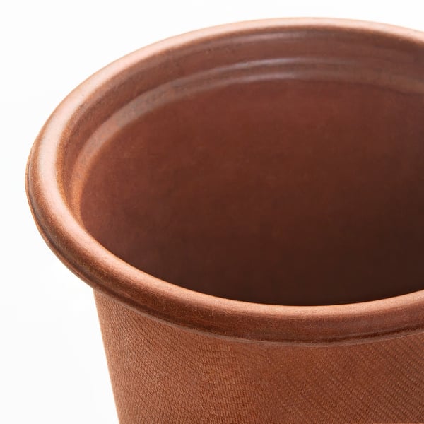 Rustic terracotta pot, smooth edges, wide opening, textured surface. Ideal for plants.