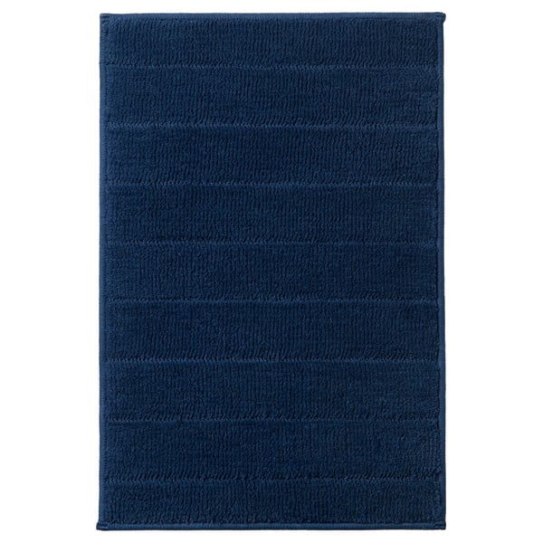TIDNINGSBUD blue rectangular bath mat, textured surface, polyester, quick drying, latex backing.
